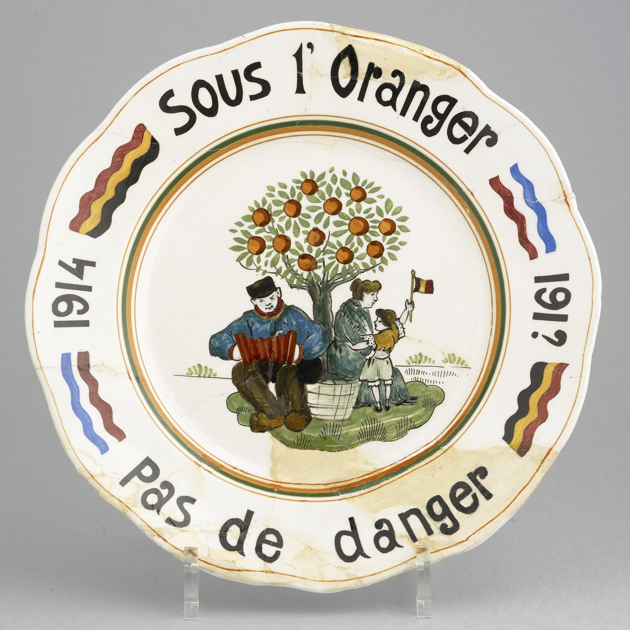 Wandbord met randschrift: 'Sous l'oranger pas de danger 1914-191?'